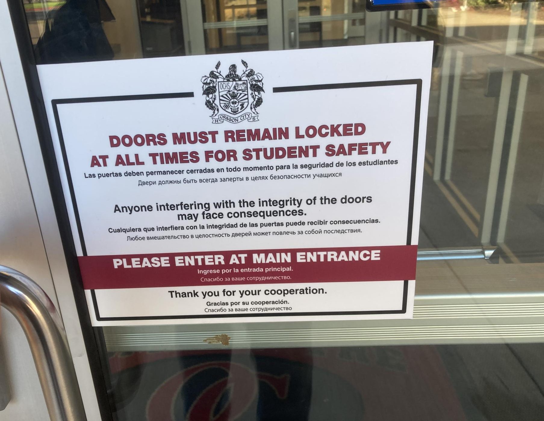 Posted on every external door, students are constantly reminded of possible security risks. These signs are part of an effort to prevent students from letting people in from outside, forcing everyone to enter through the primary entrance. Photo taken Nov. 17, 2023