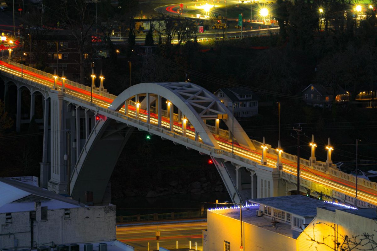 The Arch Bridge in Oregon City at night, with traffic.