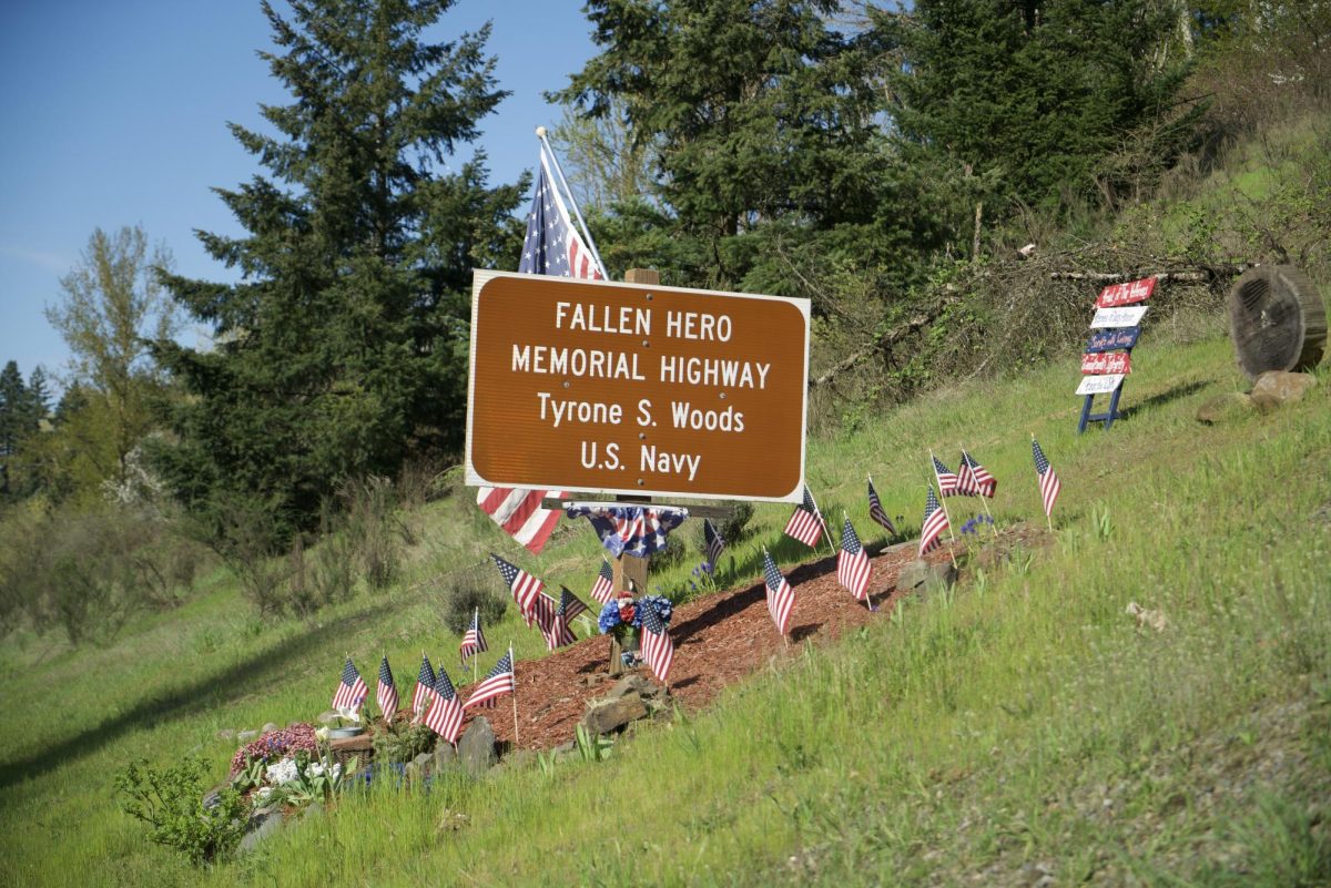 The sign dedicating Highway 213 in memory of Tyrone Woods. Put up in 2014, it has been honored by Oregon City residents since then.