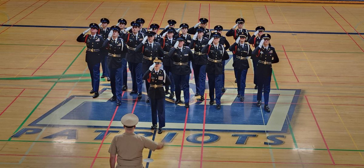 This is Oregon City High Schools JROTC 21 man unarmed drill team. We are saluting in for one of our competitions before marching.