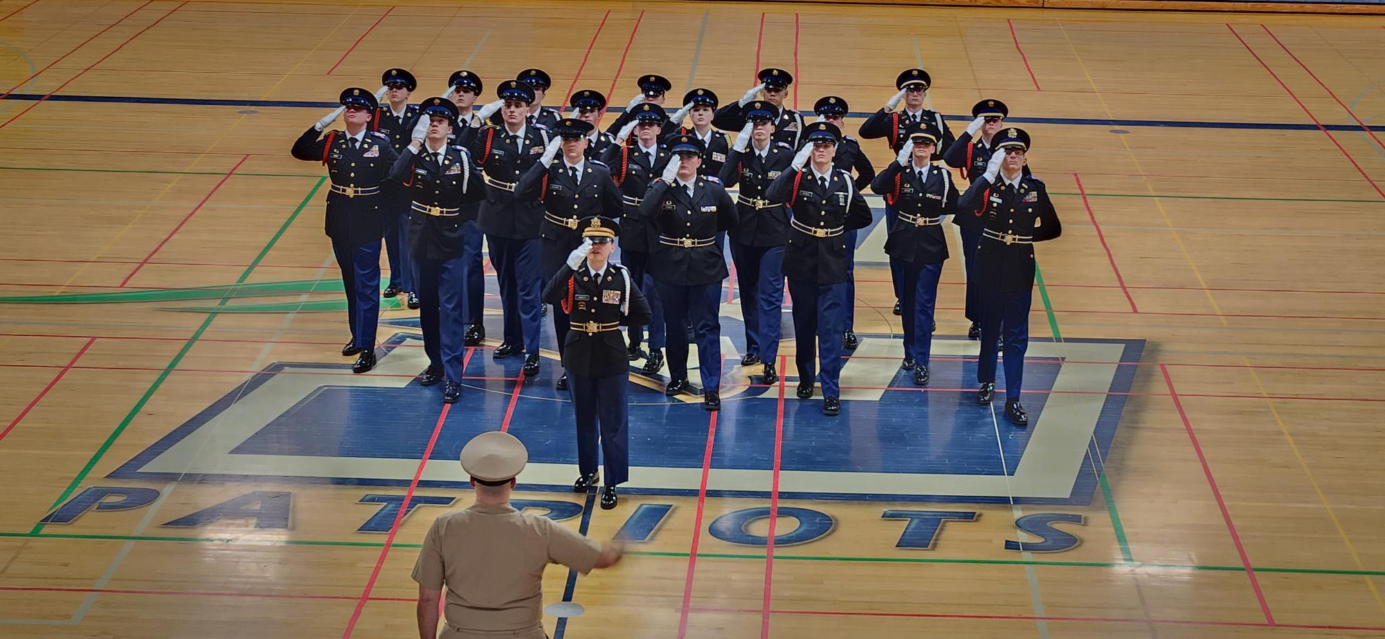 This is Oregon City High Schools JROTC 21 man unarmed drill team. We are saluting in for one of our competitions before marching.