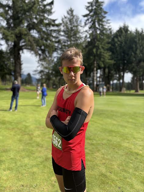 August Ostrick poses after a dominate race at this years MOOK invite running a 18:53 placing 3rd on the JV team.
