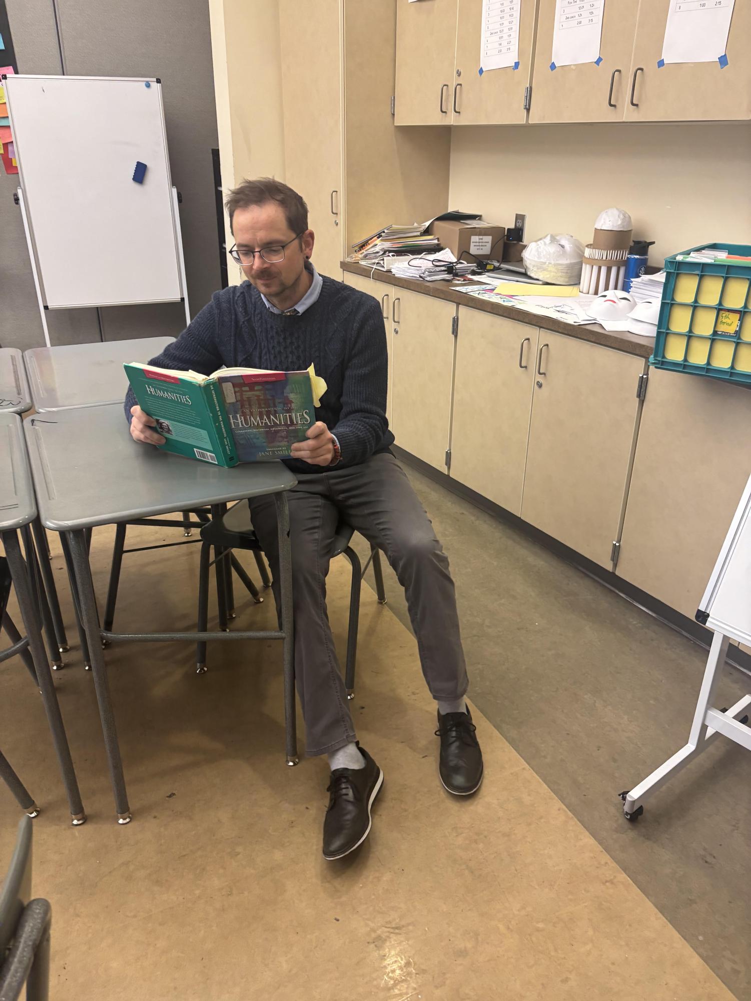 Mr. Lynn prepares to teach his upcoming Humanities class during his prep to have his students have the best learning experience as possible. 