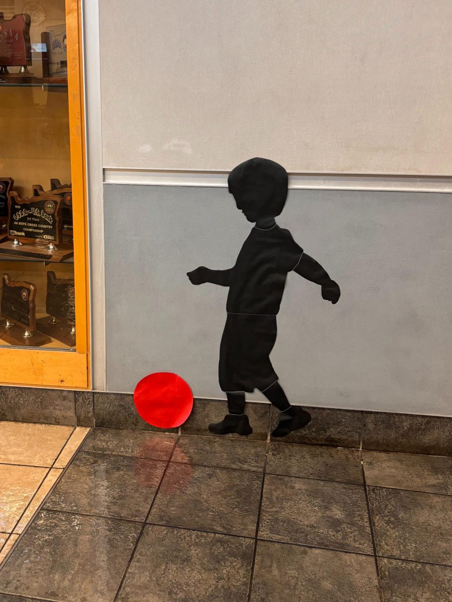 One of the many Kara Walker project's by the Hall of Fame. This is the artwork of London Shrout and Zoey Byer of a small boy kicking a ball to reflect on younger times and growth since then.