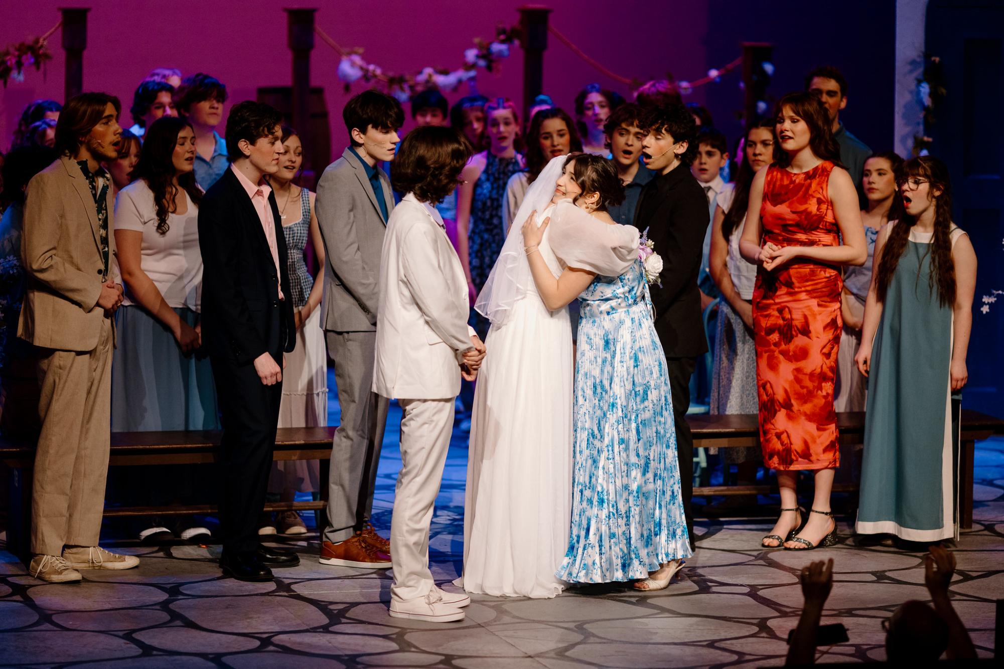The cast of Mama Mia gathers on stage for one fo the final scenes of the play. Mama Mia was the drama department's winter musical, which ran for multiple weekends in December and culminated with an audience sing along performance. 