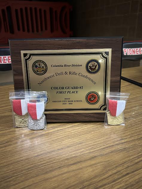 Color guard team 2 first place award with personal medals. Medals for first place color guard commander, first place duel, and second place unarmed drill down.